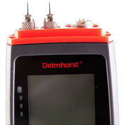 Delmhorst JX-30 Navigator wood moisture meter close-up of the contact pins and the blank display below the brand logo.